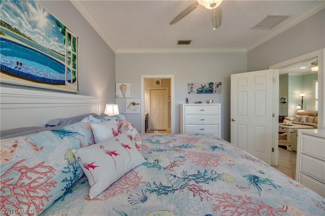10420 Peso Del Rio Drive Fort Myers, FL 33908 - Photo 25 of 50 a bedroom with a bed and a cabinets
