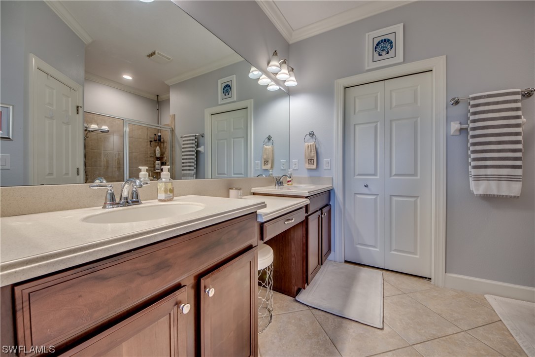 10420 Peso Del Rio Drive Fort Myers, FL 33908 - Photo 26 of 50 a bathroom with a sink double vanity and a mirror