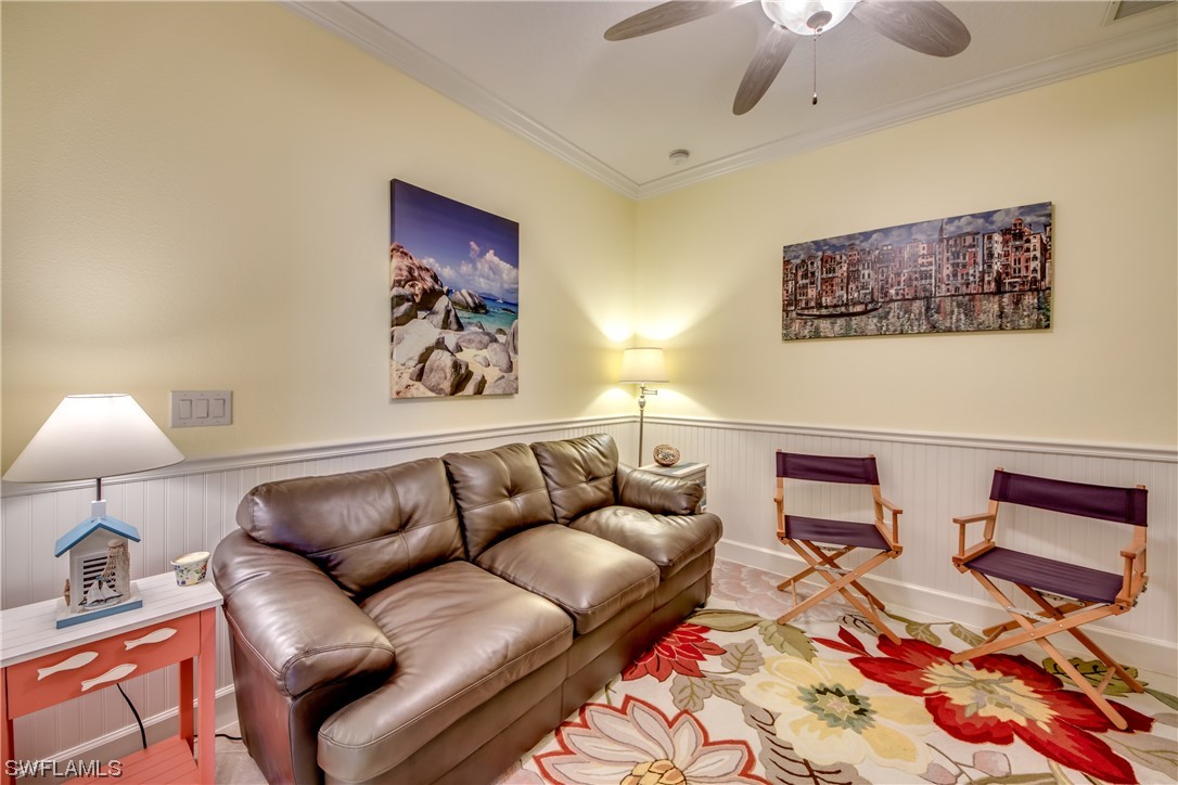 10420 Peso Del Rio Drive Fort Myers, FL 33908 - Photo 32 of 50 a living room with furniture and a lamp