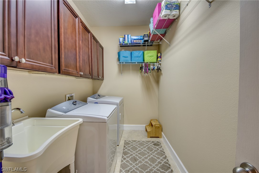 10420 Peso Del Rio Drive Fort Myers, FL 33908 - Photo 33 of 50 a utility room with dryer and washer