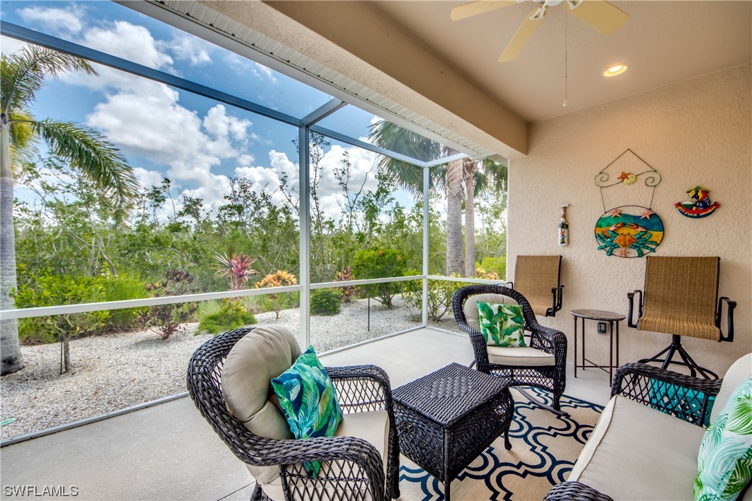 10420 Peso Del Rio Drive Fort Myers, FL 33908 - Photo 35 of 50 a balcony with furniture and a potted plant