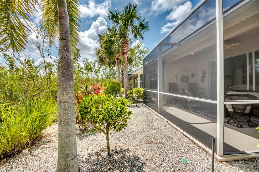 10420 Peso Del Rio Drive Fort Myers, FL 33908 - Photo 39 of 50 a flower plants with wooden fence
