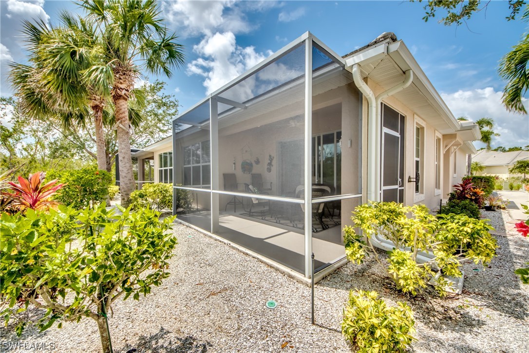 10420 Peso Del Rio Drive Fort Myers, FL 33908 - Photo 40 of 50 a view of a garden with potted plants