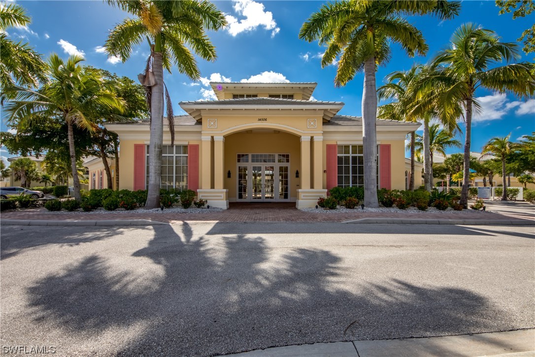 10420 Peso Del Rio Drive Fort Myers, FL 33908 - Photo 42 of 50 a view of a building with a palm tree