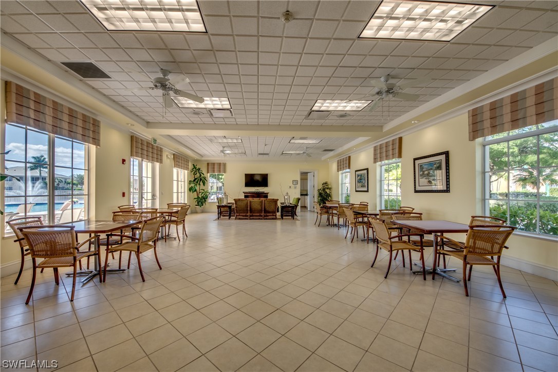 10420 Peso Del Rio Drive Fort Myers, FL 33908 - Photo 44 of 50 a dining hall with lots of tables and chairs
