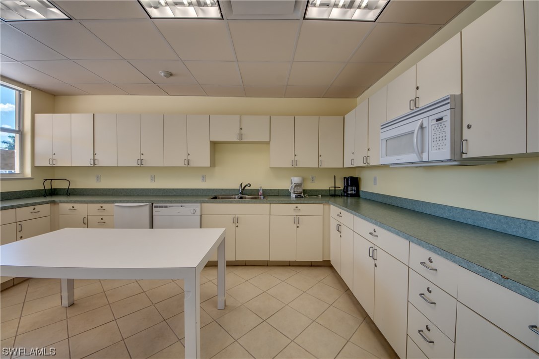 10420 Peso Del Rio Drive Fort Myers, FL 33908 - Photo 46 of 50 a kitchen with a sink and cabinets
