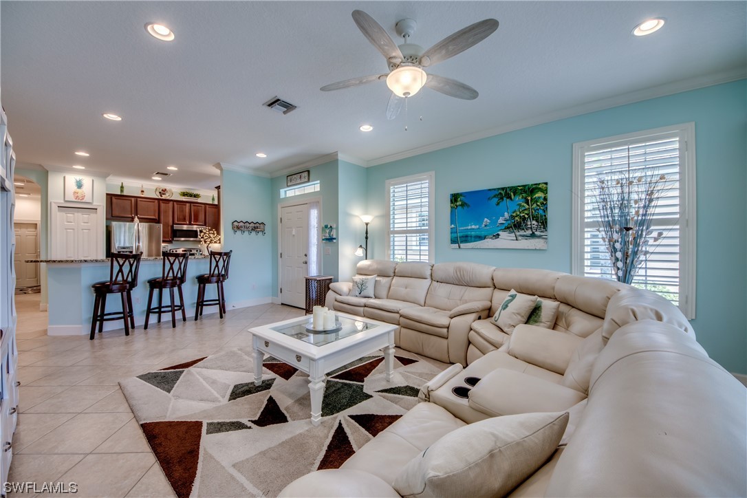 10420 Peso Del Rio Drive Fort Myers, FL 33908 - Photo 7 of 50 a living room with furniture and kitchen view