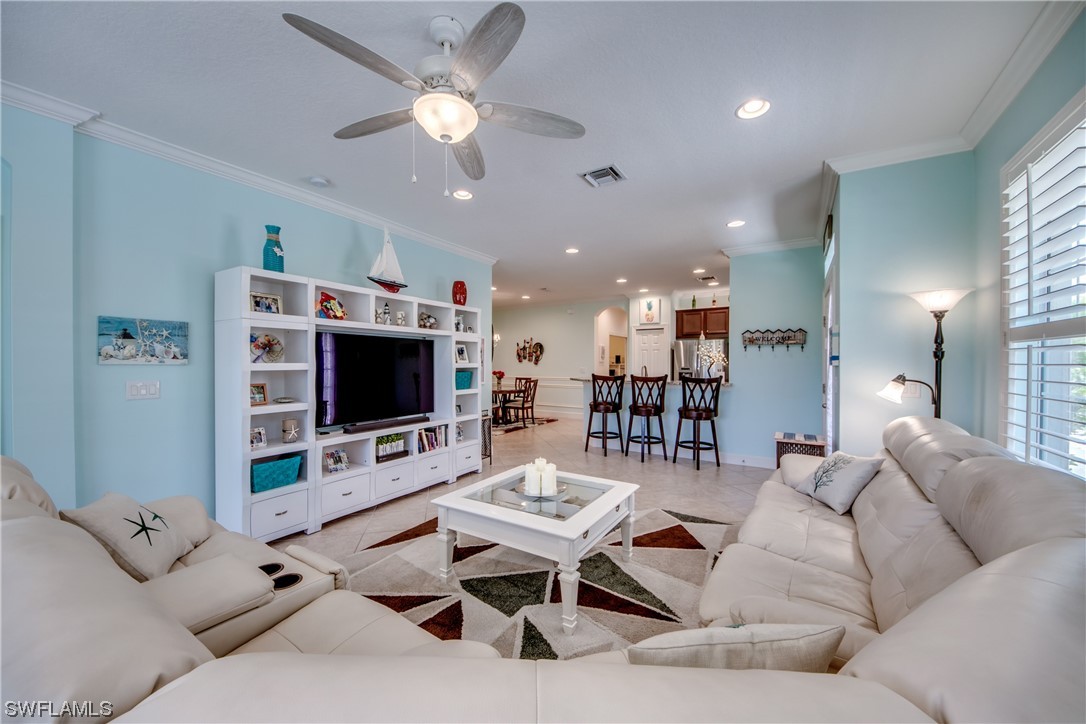 10420 Peso Del Rio Drive Fort Myers, FL 33908 - Photo 8 of 50 a living room with furniture and a flat screen tv
