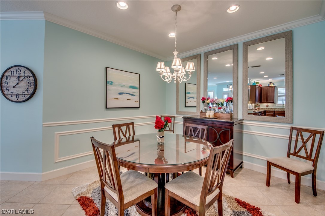 10420 Peso Del Rio Drive Fort Myers, FL 33908 - Photo 9 of 50 a view of a dining room with furniture and chandelier