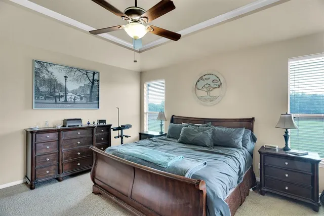 a bathroom with a bathtub a double vanity sink and mirror
