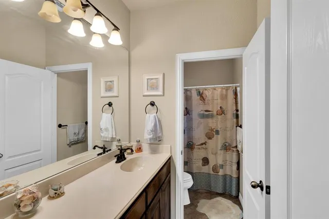 a kitchen with a sink cabinets and white appliances