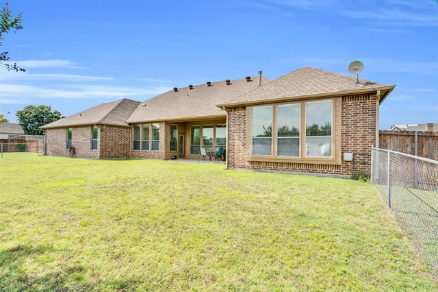 a view of a field with an ocean view