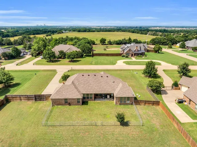 an aerial view of a house with a garden