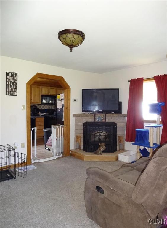 130 West Mountain Road Wind Gap, PA 18091 - Photo 9 of 43 Living Room has a corner fireplace with pellet sto