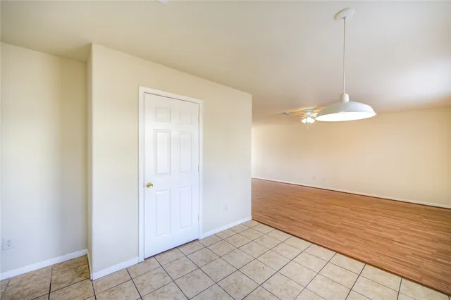 a kitchen with stainless steel appliances granite countertop a stove a sink dishwasher a refrigerator and a stove top oven