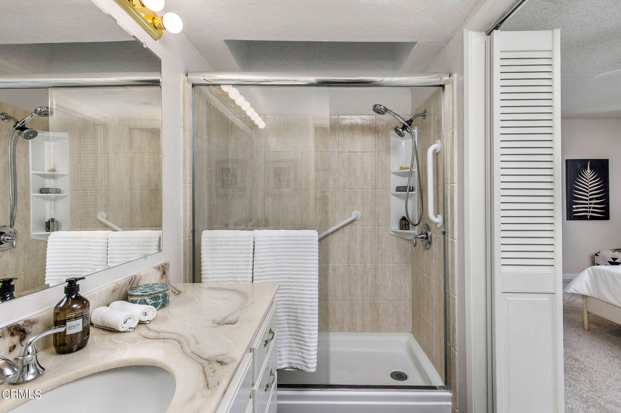 460 Fairview Avenue, Unit 12 Arcadia, CA 91007 - Photo 18 of 25 a view of a bathroom with a tub shower and a sink