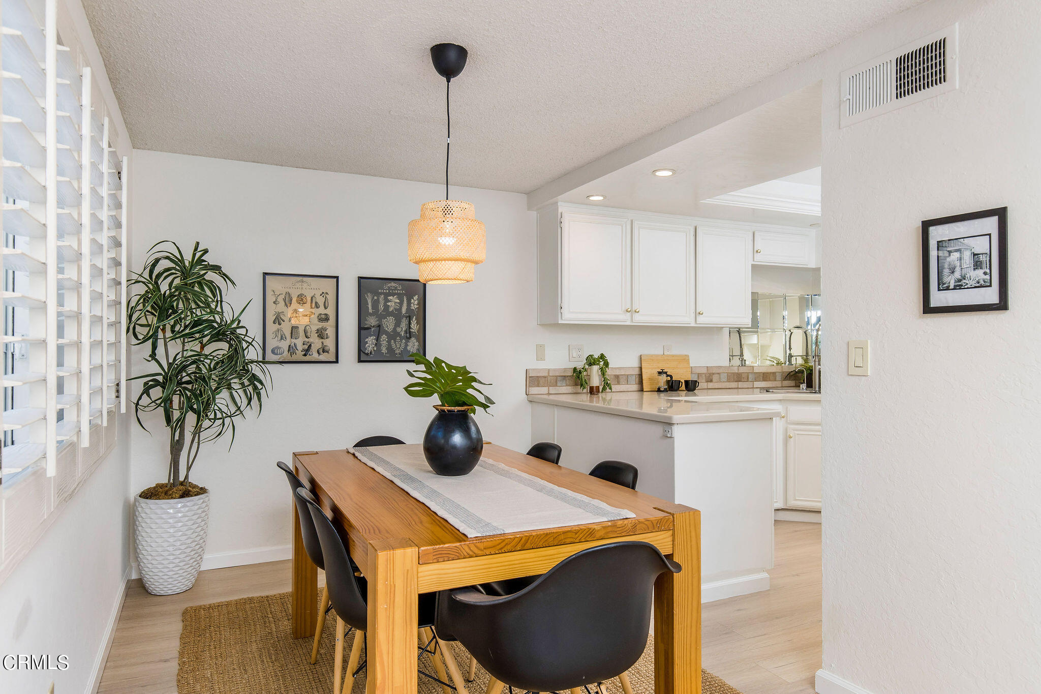 460 Fairview Avenue, Unit 12 Arcadia, CA 91007 - Photo 6 of 25 a kitchen with a table and chairs in it