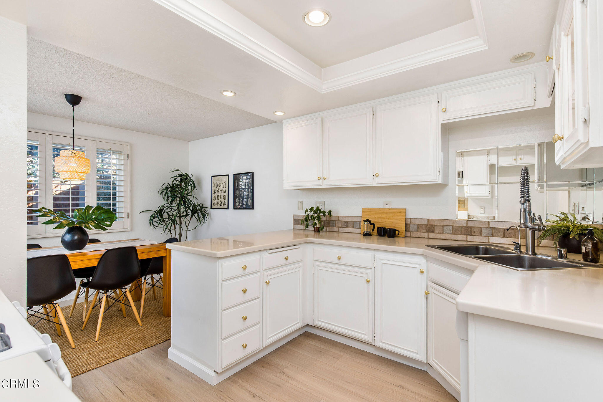 460 Fairview Avenue, Unit 12 Arcadia, CA 91007 - Photo 7 of 25 a kitchen with cabinets and chairs in it