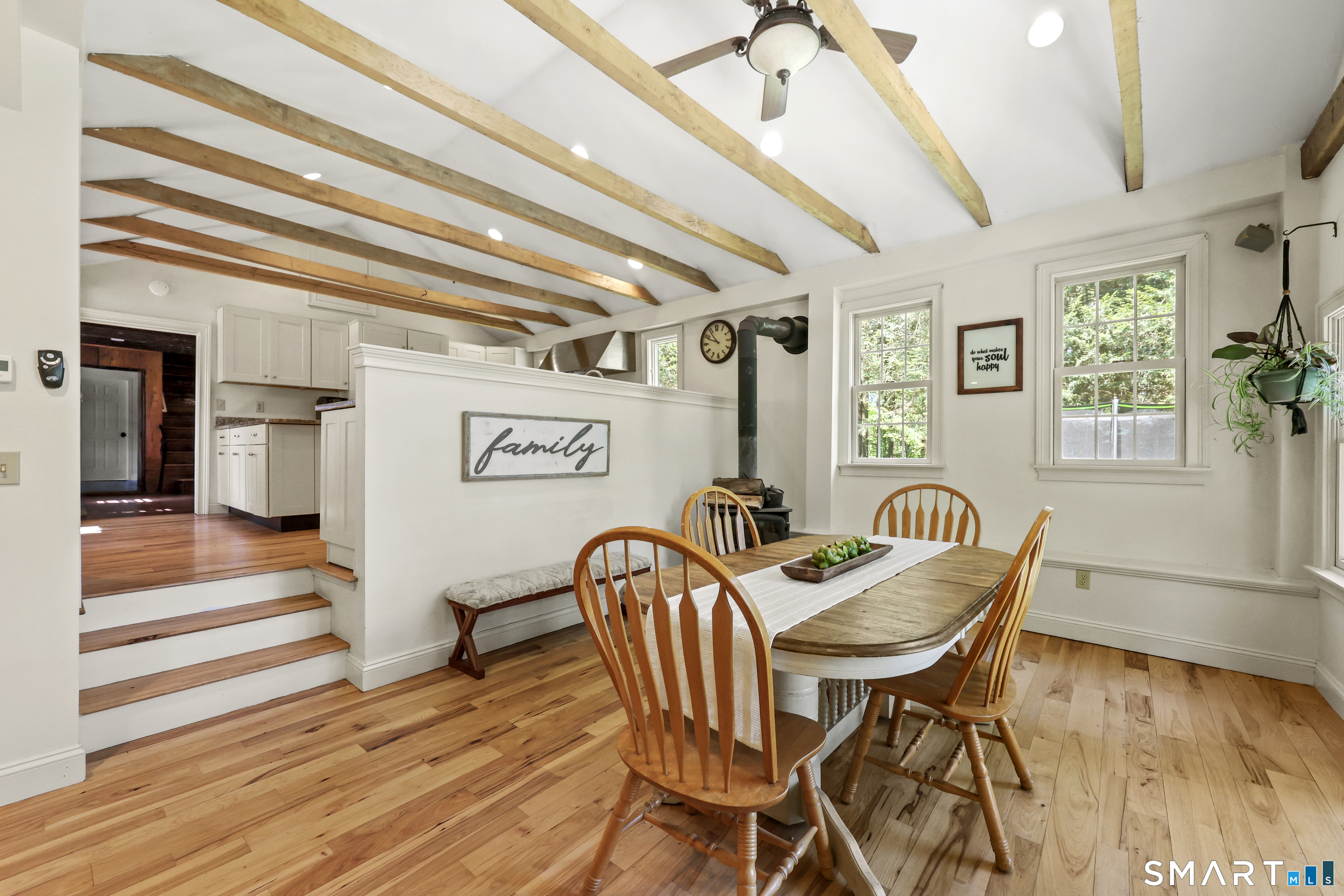 2880 Main Street Coventry, CT 06238 - Photo 9 of 40 Open concept flow from kitchen to sunroom/eat-in dining room.