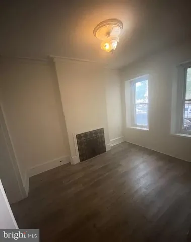 a view of room with a ceiling fan and window