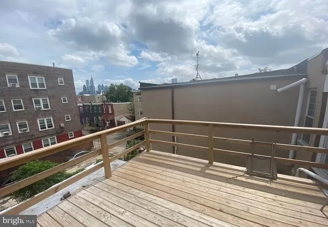a view of balcony with wooden floor