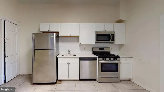 a kitchen with a stove microwave and refrigerator