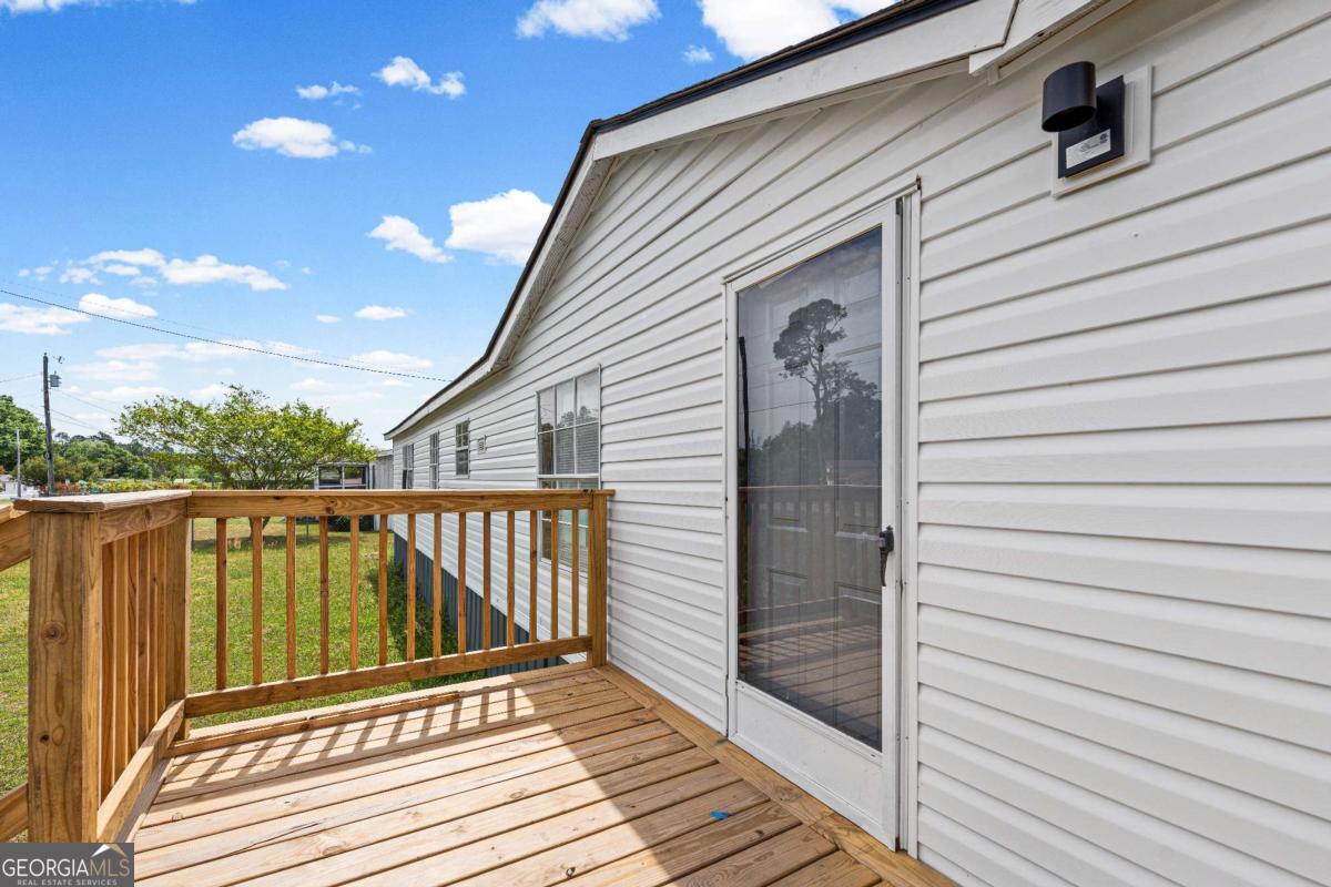 802 Allen Drive Vidalia, GA 30474 - Photo 13 of 29 a view of a balcony with wooden floor
