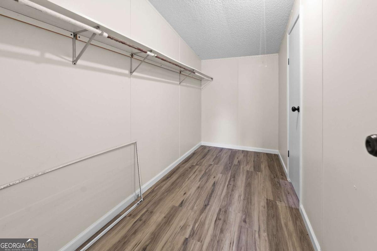 802 Allen Drive Vidalia, GA 30474 - Photo 20 of 29 a view of a room with wooden floor