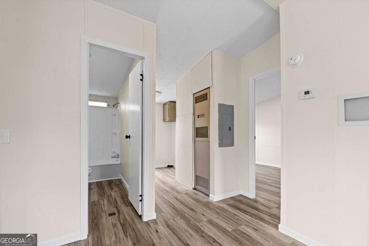 802 Allen Drive Vidalia, GA 30474 - Photo 24 of 29 a view of a bathroom with a sink and a mirror