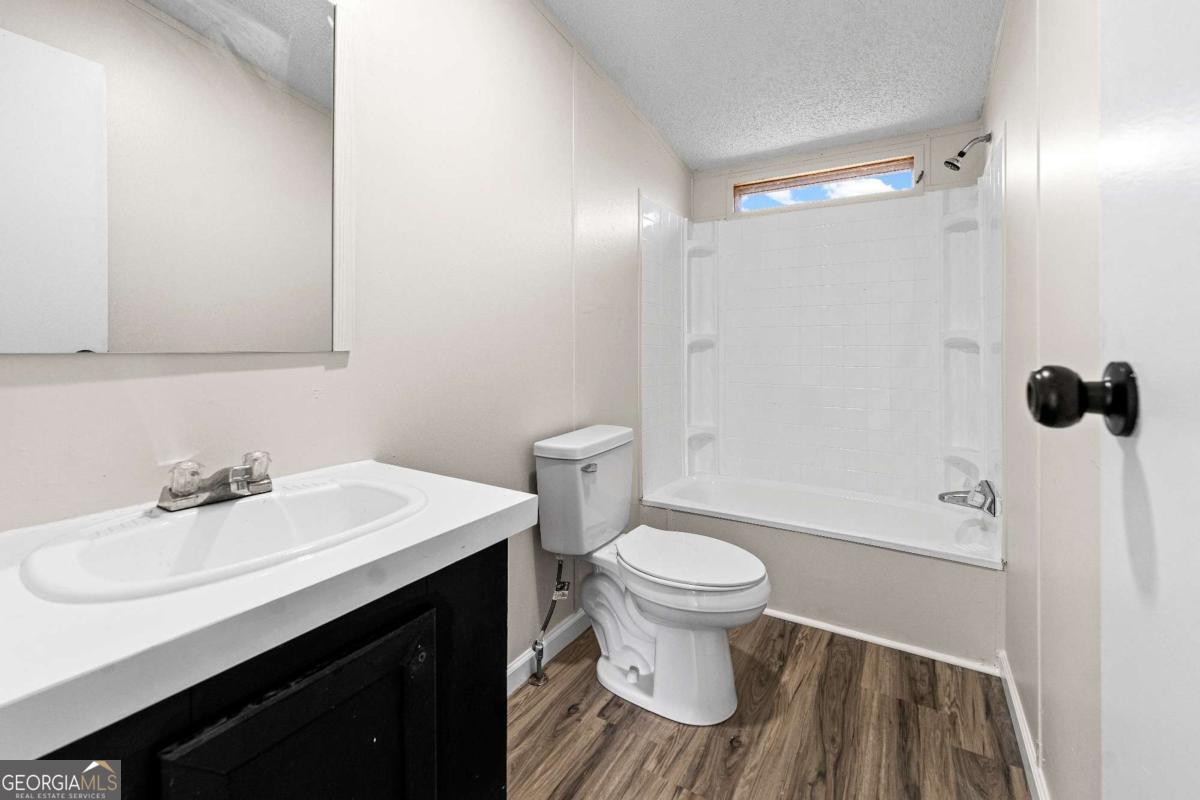 802 Allen Drive Vidalia, GA 30474 - Photo 26 of 29 a bathroom with a sink and a mirror