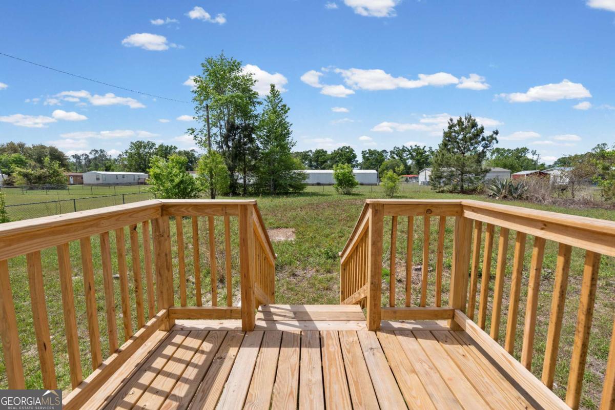 802 Allen Drive Vidalia, GA 30474 - Photo 29 of 29 a view of balcony with wooden floor & fence