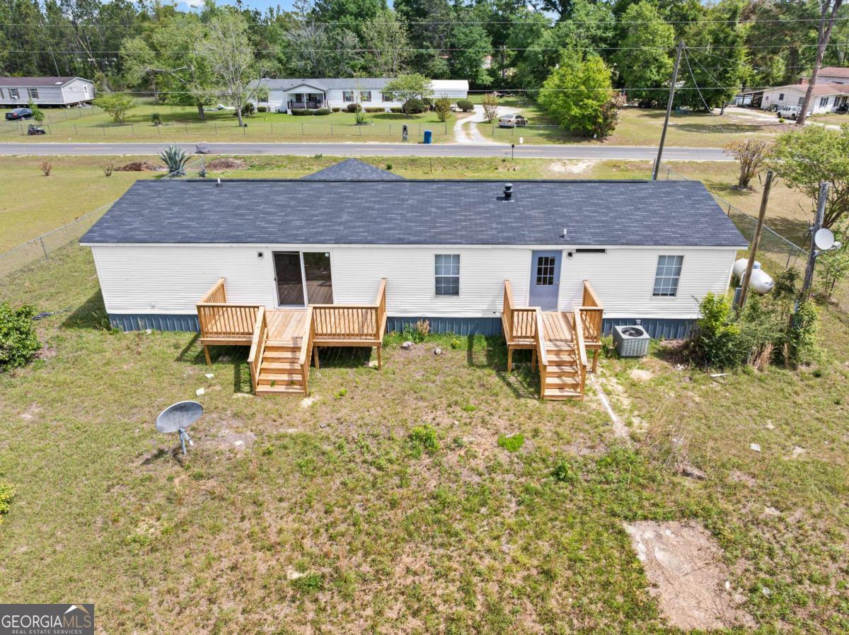 802 Allen Drive Vidalia, GA 30474 - Photo 3 of 29 a aerial view of a house with a yard