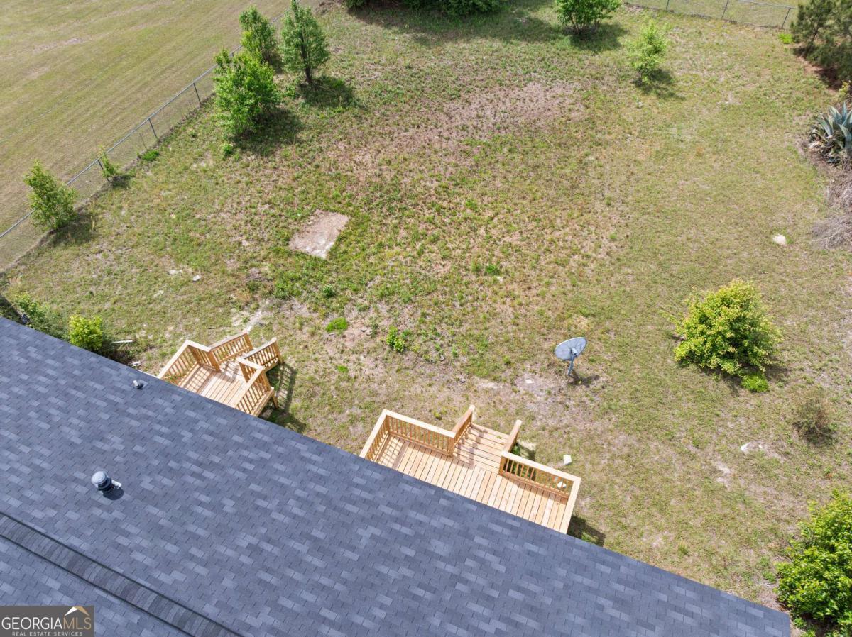 802 Allen Drive Vidalia, GA 30474 - Photo 10 of 29 a view of a pathway both side of yard