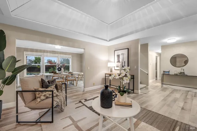 a living room with furniture and a potted plant