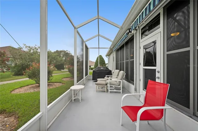 a view of a patio with couches chairs and potted plants