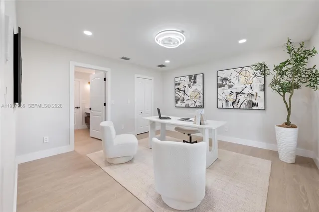 a bathroom with a granite countertop sink a toilet and bathtub