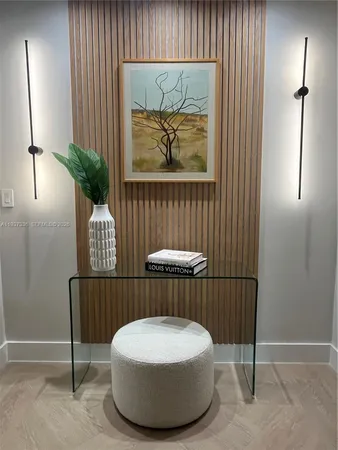 a living room with furniture potted plant and a window