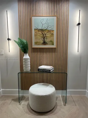 a living room with furniture potted plant and a window