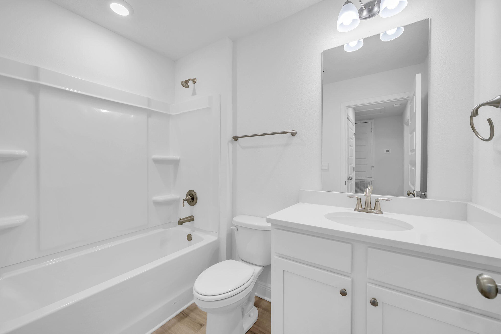 22 Redbird Loop Destin, FL 32541 - Photo 33 of 40 a bathroom with a sink a toilet and a mirror