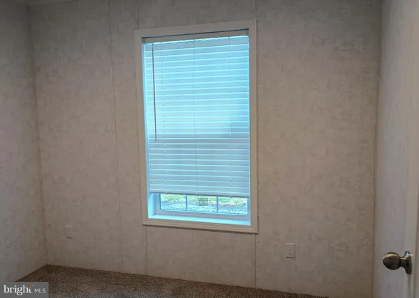 a view of a room that has a window in it