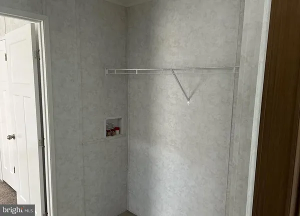 a bathroom with a glass shower door