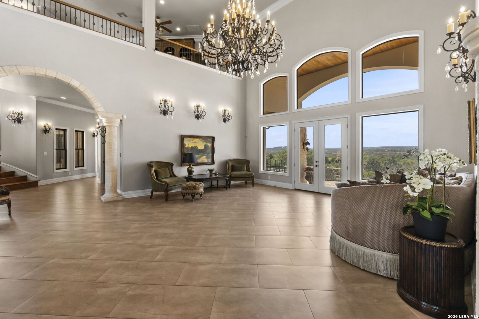 6762 Mnr Hl Road San Antonio, TX 78257 - Photo 12 of 51 a living room with furniture and a chandelier