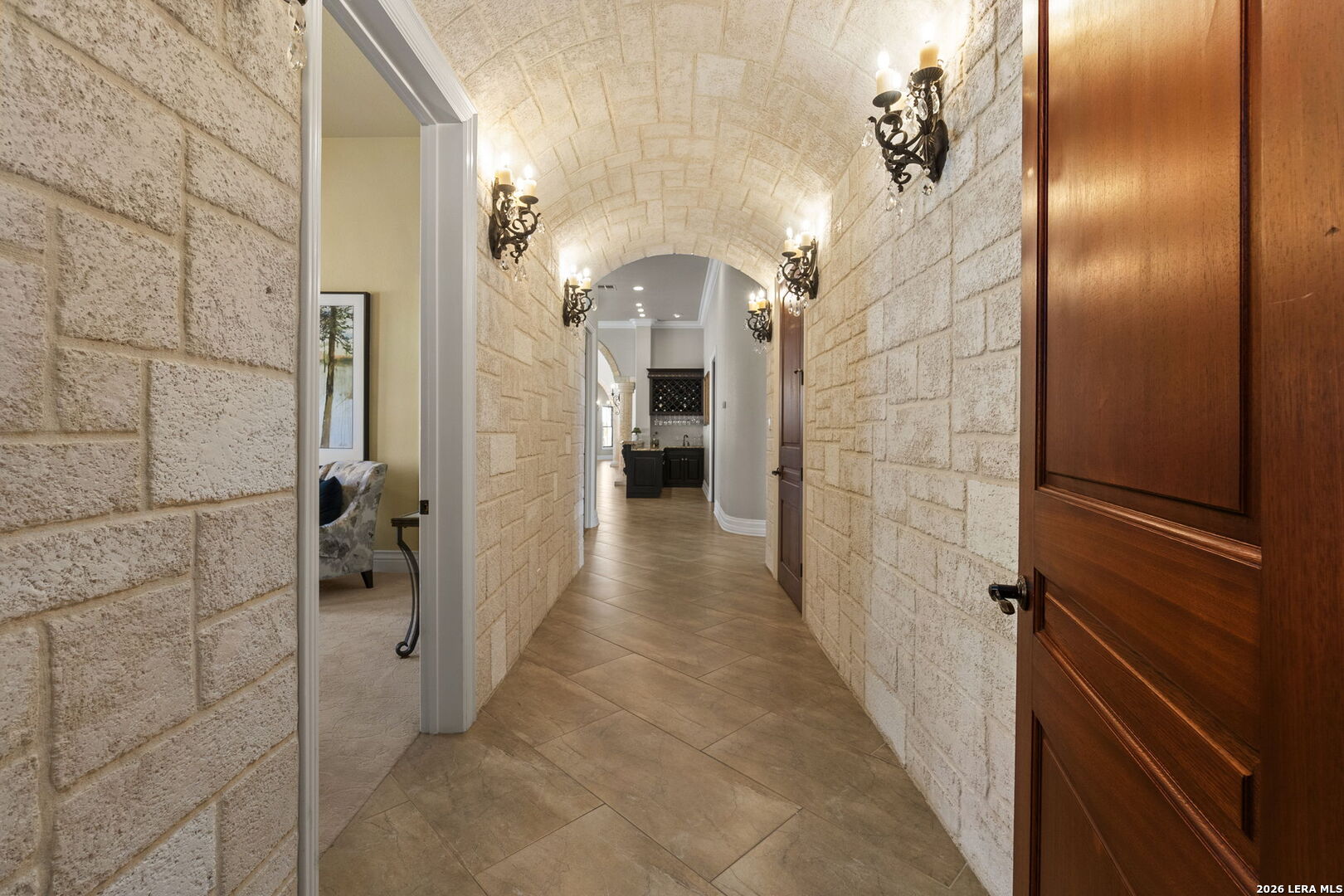 6762 Mnr Hl Road San Antonio, TX 78257 - Photo 19 of 51 a view of a hallway with wooden shelves