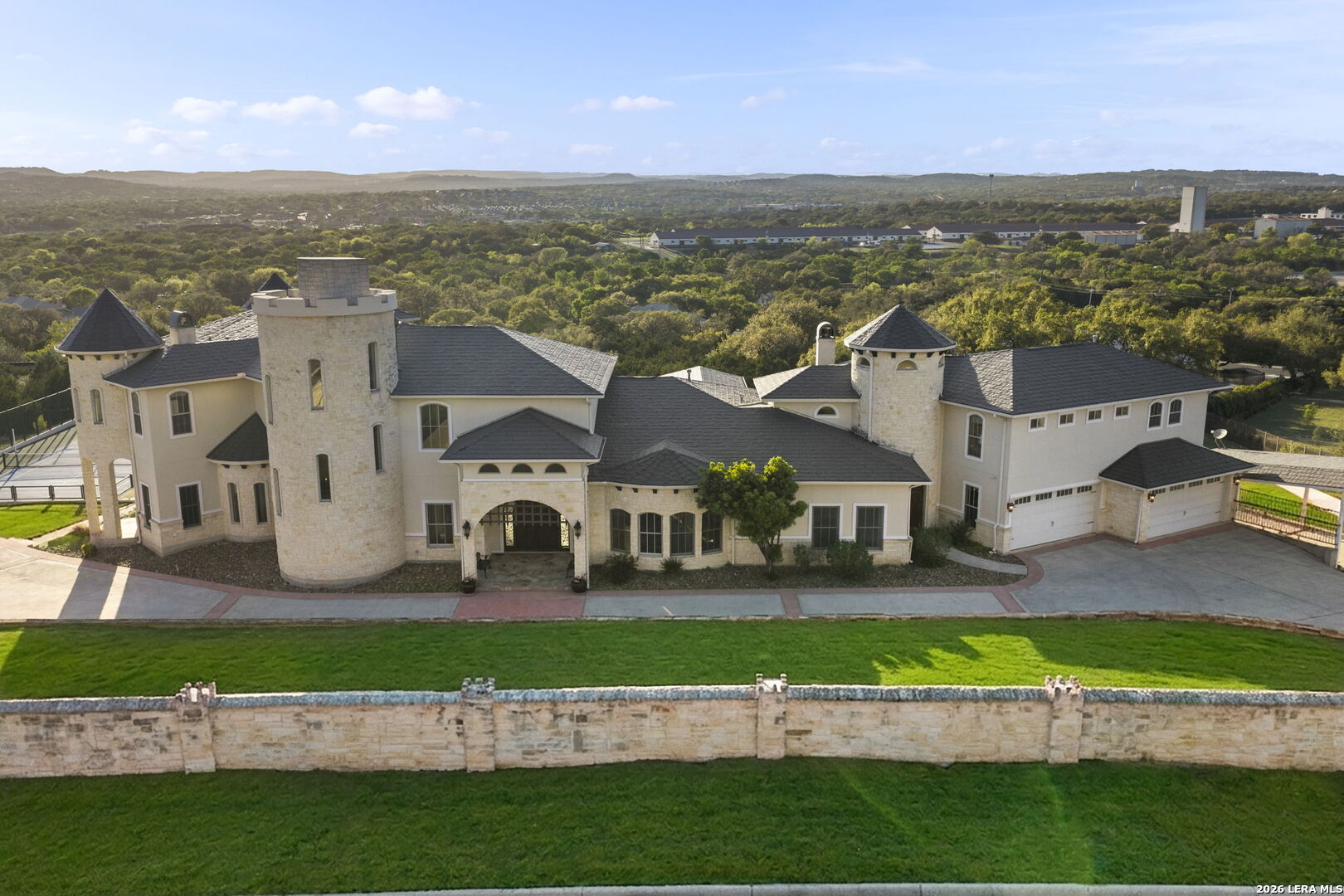 6762 Mnr Hl Road San Antonio, TX 78257 - Photo 2 of 51 an aerial view of a house with a big yard and potted plants