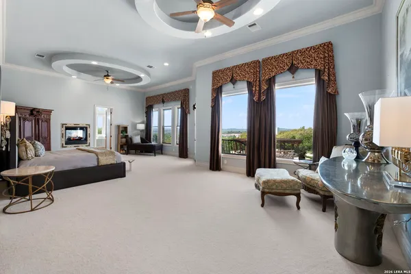 a view of a livingroom with a fireplace washer and dryer