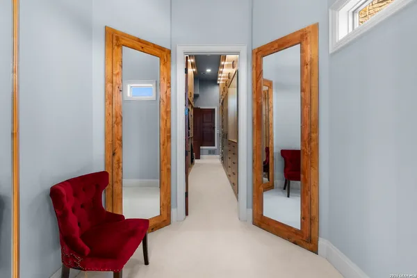 a kitchen that has a sink wooden cabinets and stainless steel appliances