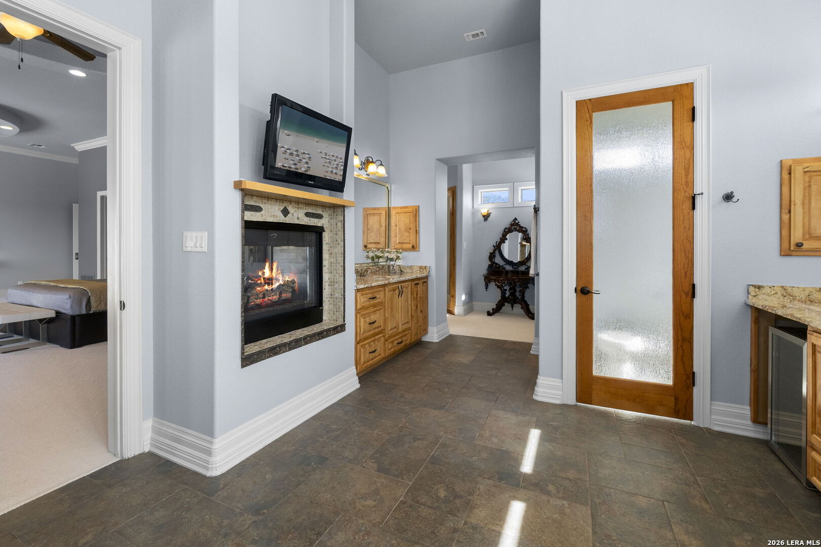 6762 Mnr Hl Road San Antonio, TX 78257 - Photo 28 of 51 a view of a livingroom with a fireplace washer and dryer