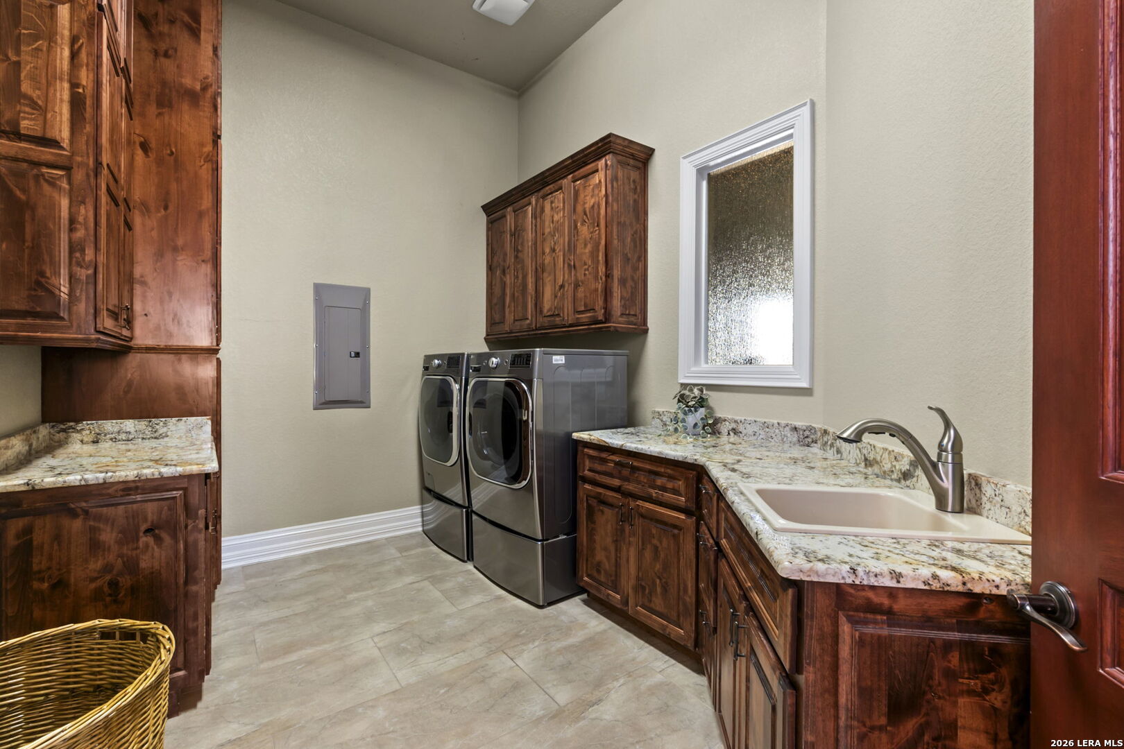 6762 Mnr Hl Road San Antonio, TX 78257 - Photo 29 of 51 a kitchen that has a sink wooden cabinets and stainless steel appliances