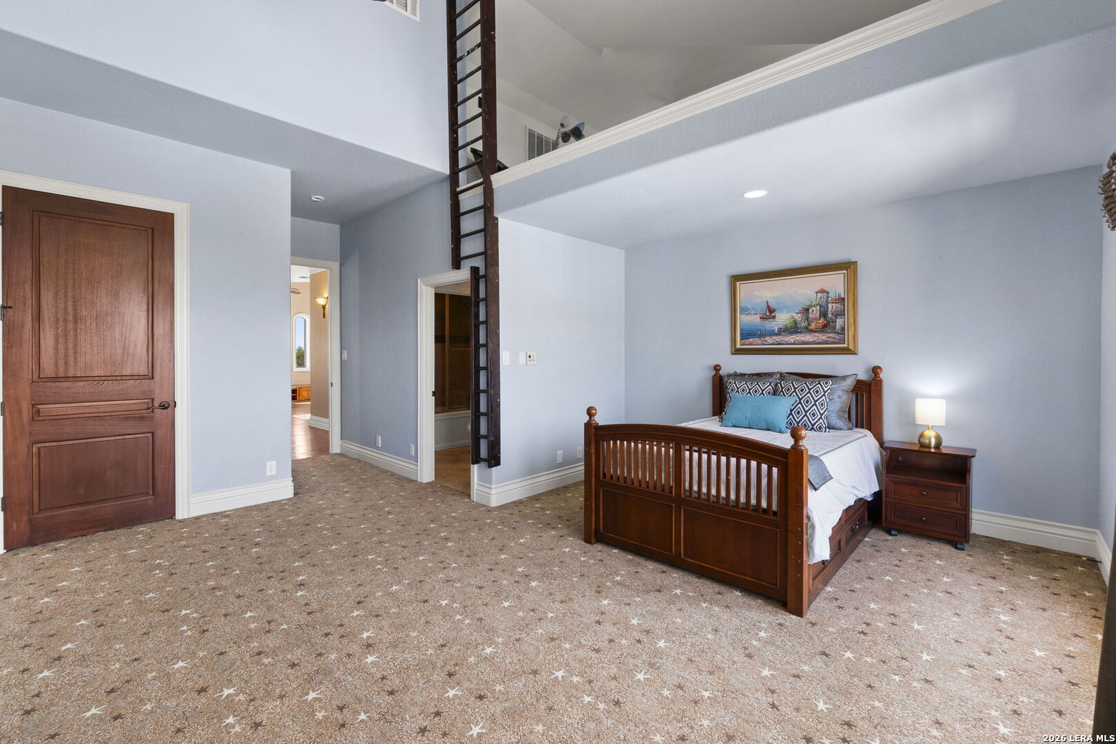 6762 Mnr Hl Road San Antonio, TX 78257 - Photo 37 of 51 a spacious bedroom with a bed and a chandelier