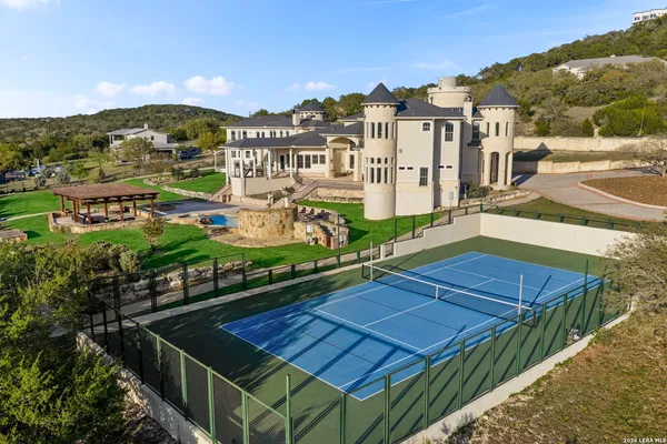 a front view of a house with many windows